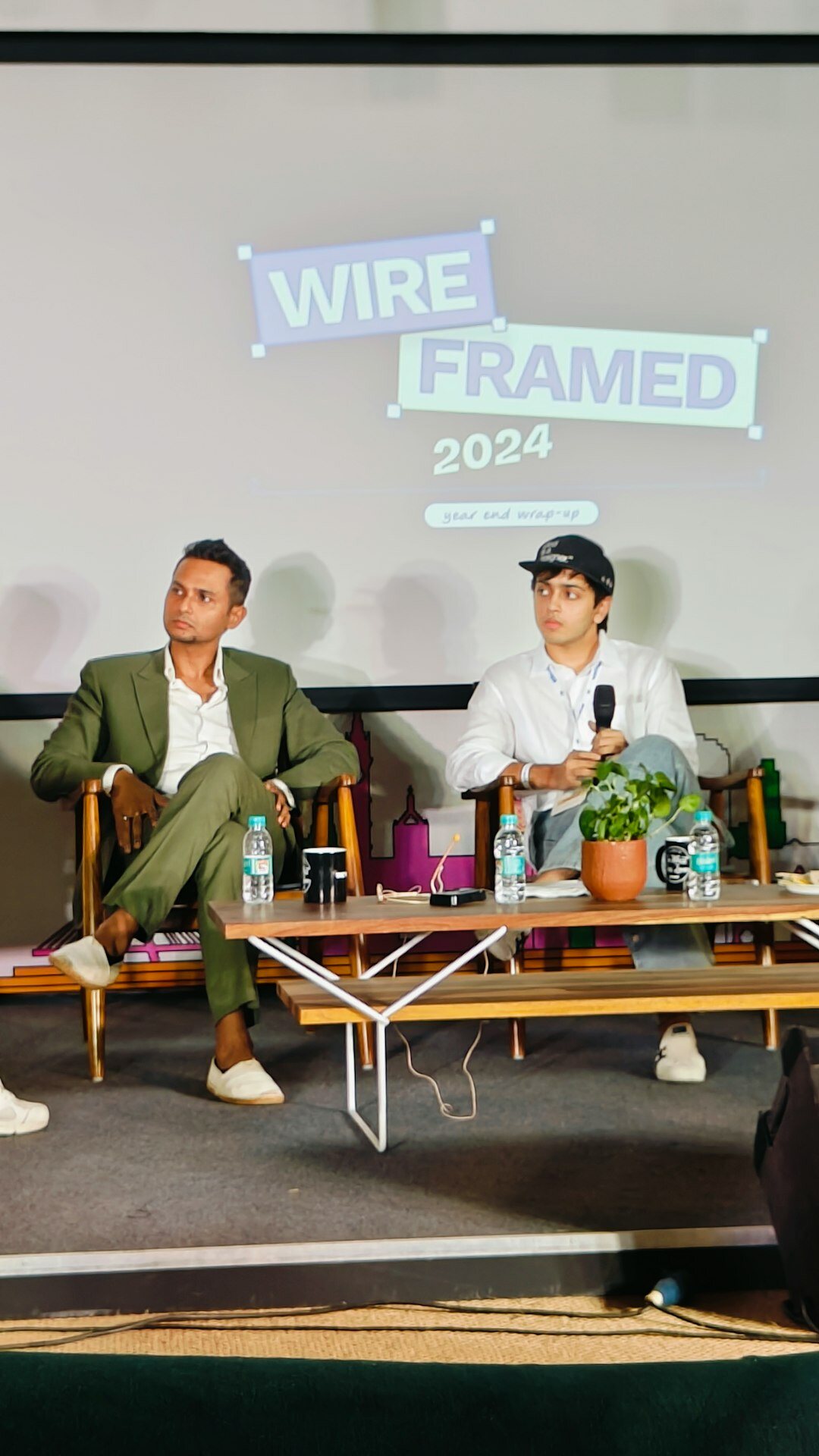 Business conference panel discussion with four speakers
