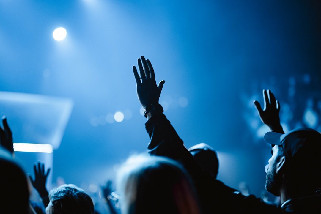 Business conference audience applauding in a modern hall